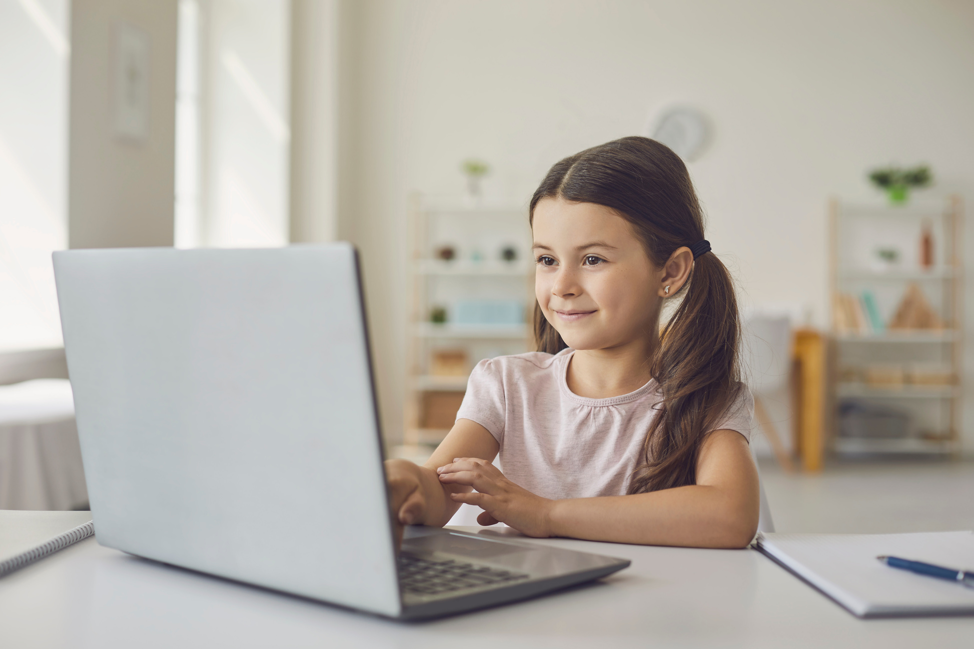 Smiling Girl Learning Online at Laptop from Home